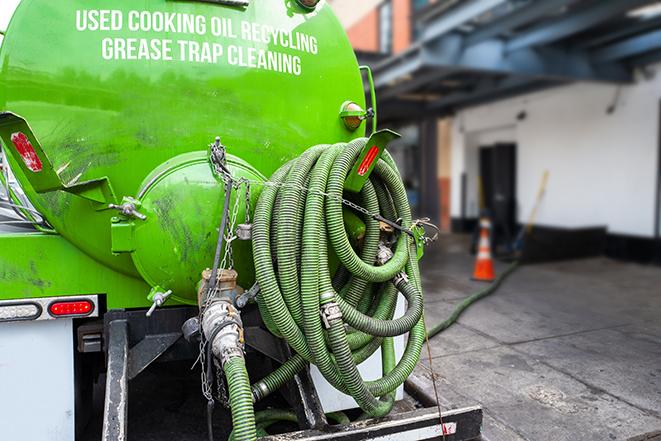 grease trap pumping truck servicing a restaurant in Azusa